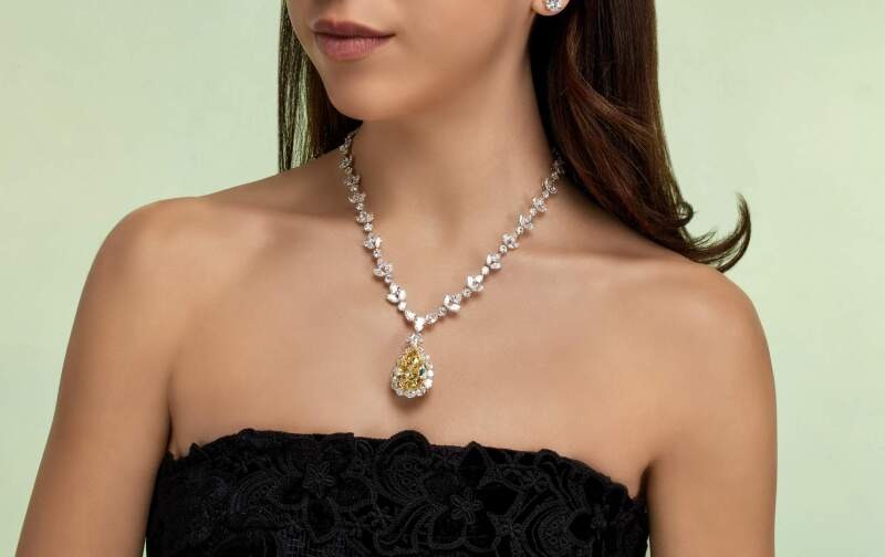 Platinum, 35.31ct Pear Shape Fancy Intense Yellow Diamond and Diamond Pendant Necklace