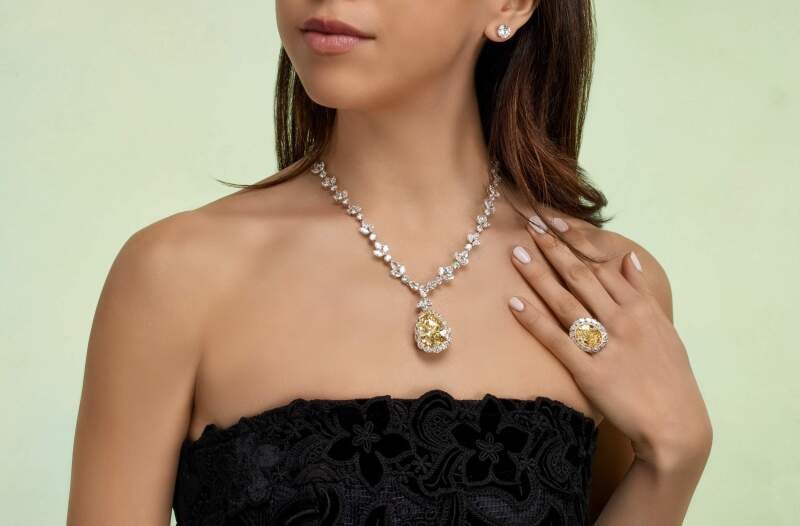 Platinum, 35.31ct Pear Shape Fancy Intense Yellow Diamond and Diamond Pendant Necklace